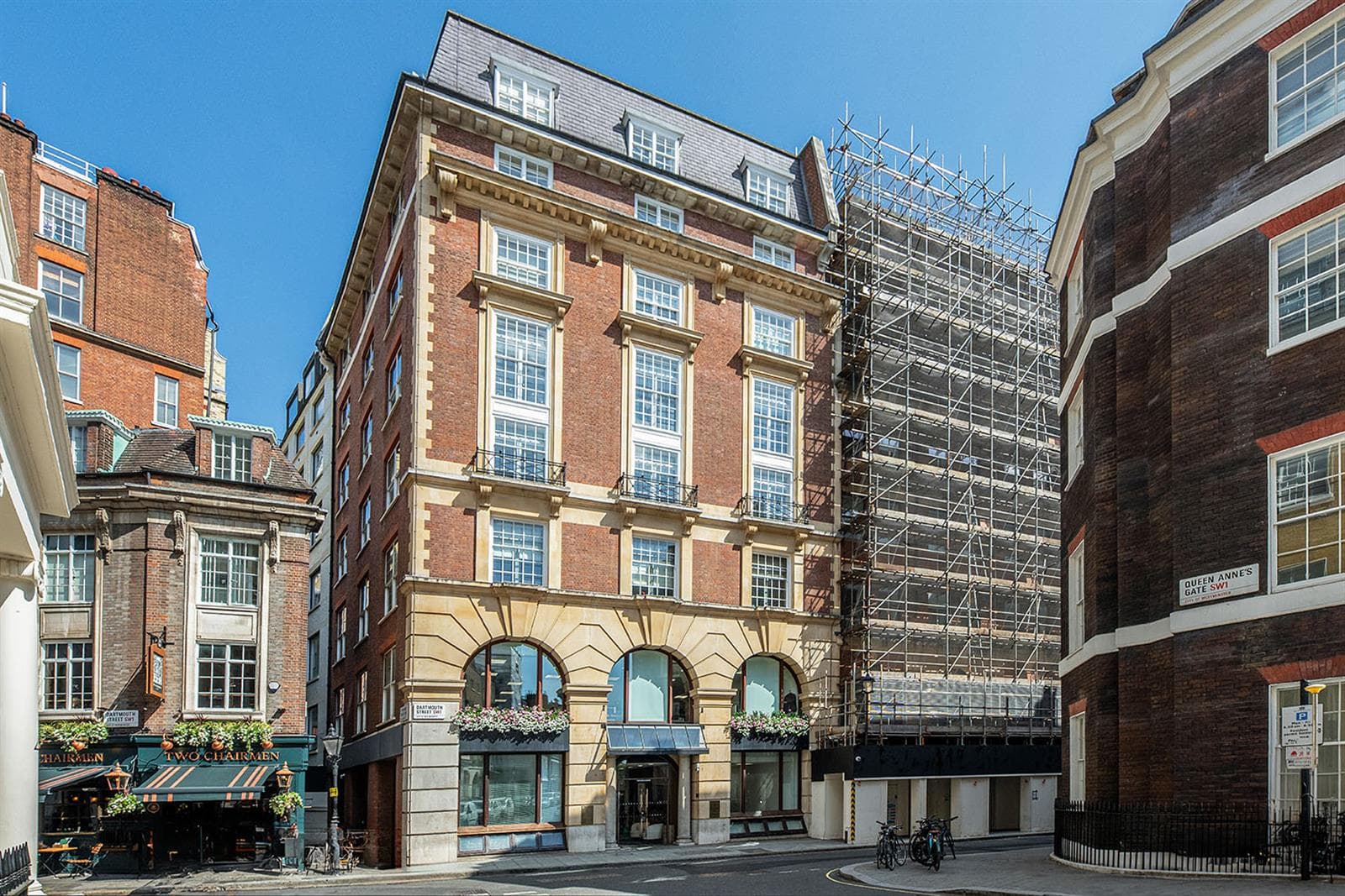 The red-brick façade of 2 Queen Anne’s Gate Buildings with The Two Chairmen pub next door